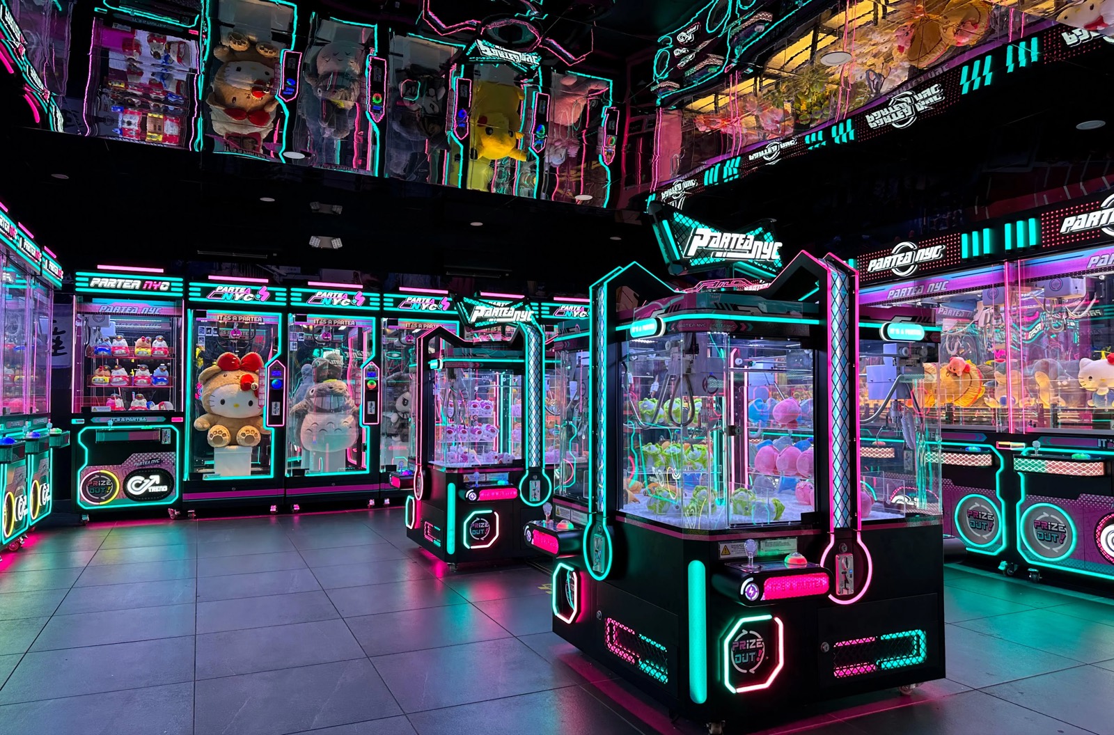 Partea NYC claw machine arcade in Union Square, cyan and magenta neon